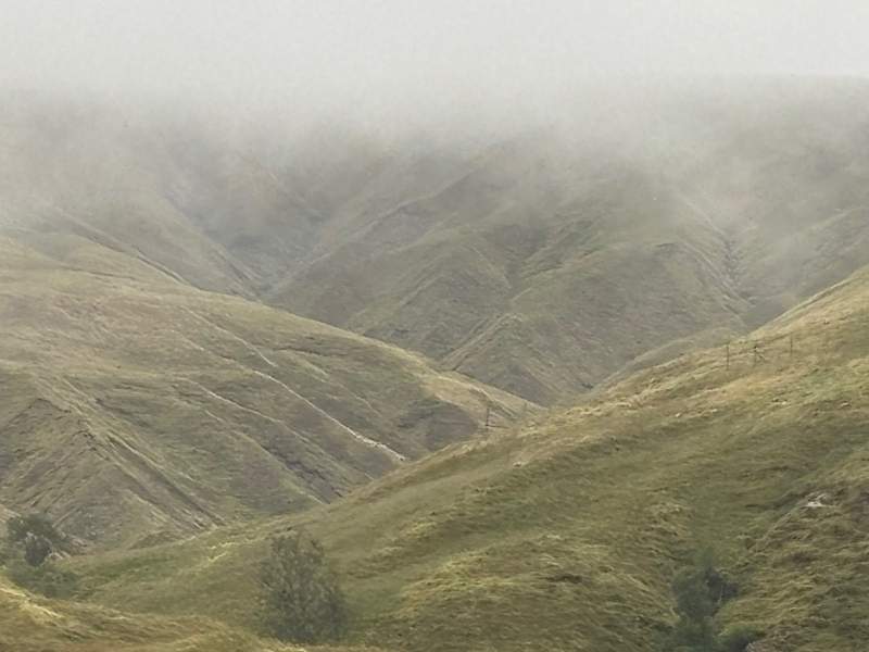 Clouds and green hills