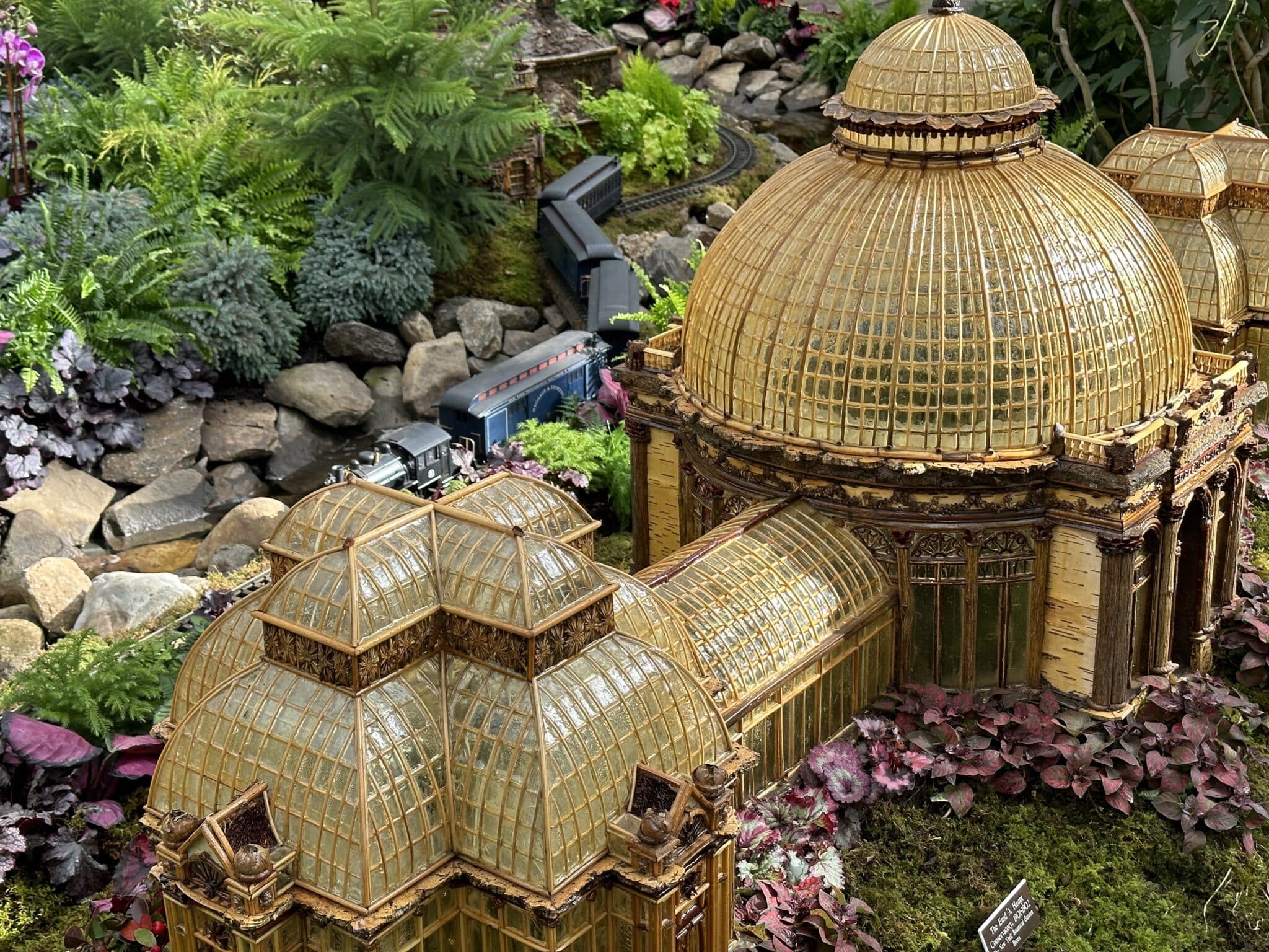 Replica of the NYBG Enid Haupt Conservatory at the Holiday Train Show, a popular NYC Christmas event