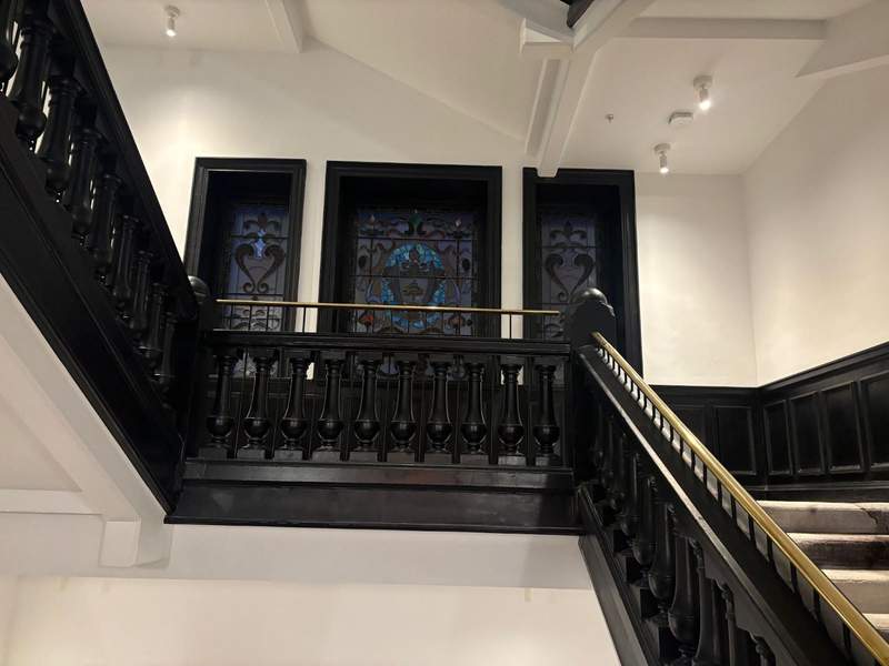 Historic staircase and stained glass at AC Glasgow