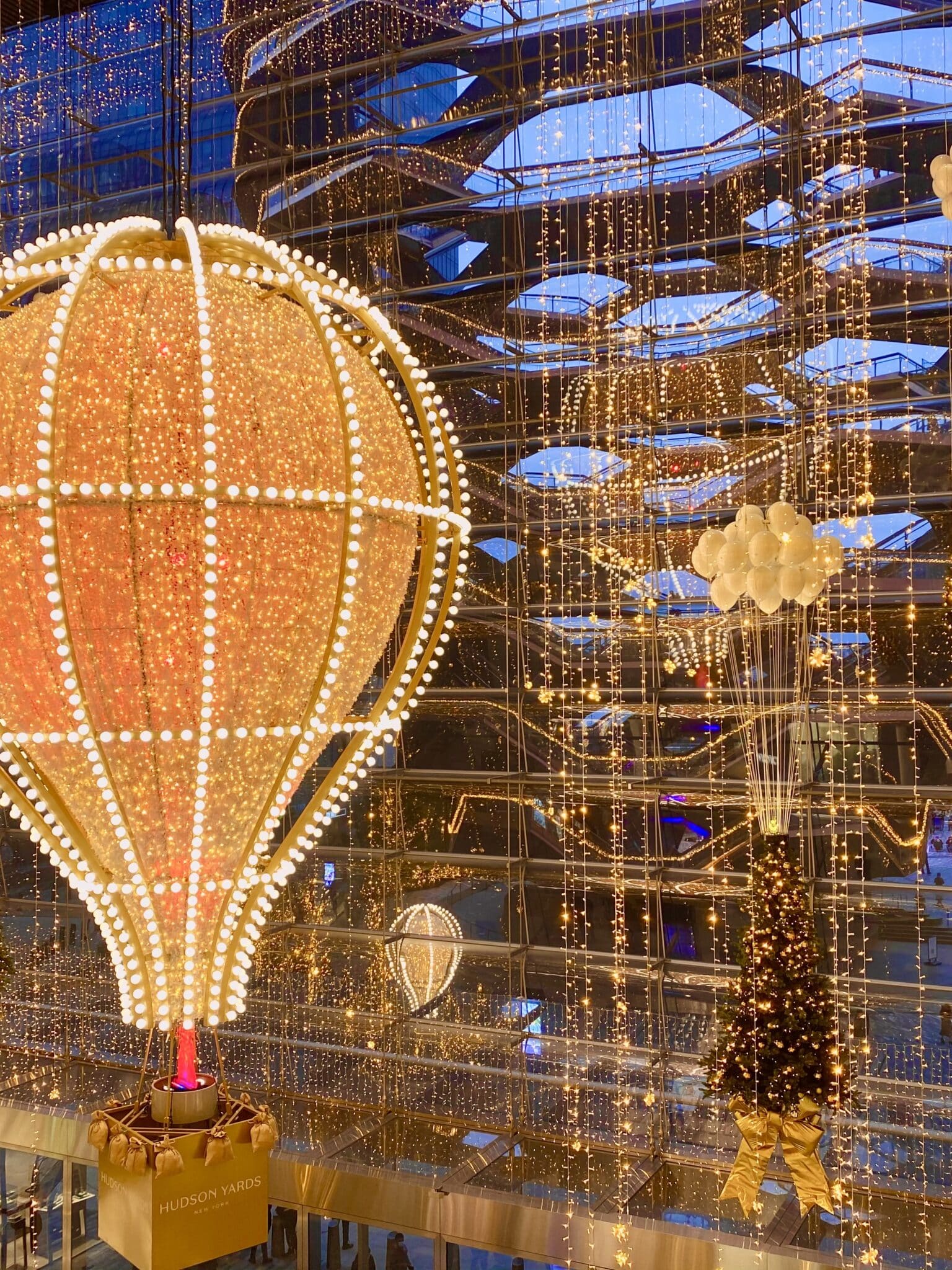 Glittering hot air balloon suspended in Hudson Yards, a fun thing to see during Christmas in NYC
