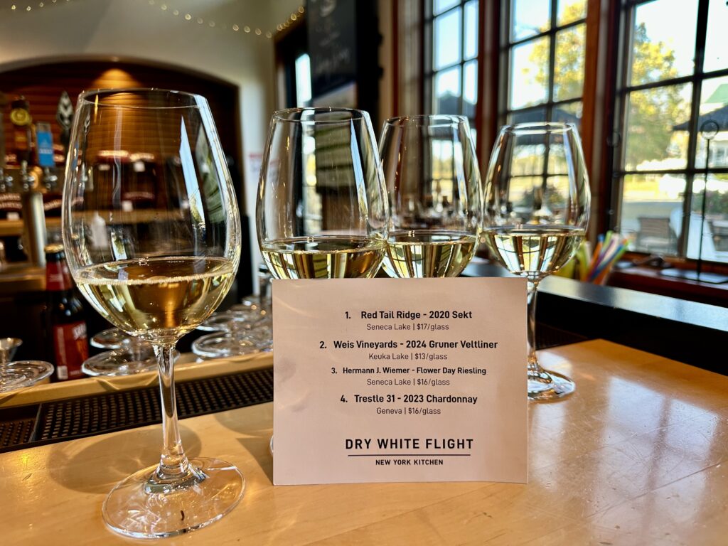 Four wineglasses in a flight of Dry White wines from New York's Finger Lakes at the New York Kitchen in Canandaigua.