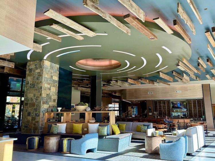 Spacious interior of the Limelight Hotel featuring warm wood accents, comfortable seating, and a rustic mountain-inspired design.