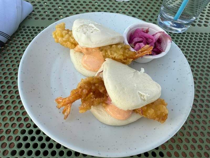 Two shrimp bao buns on a plate