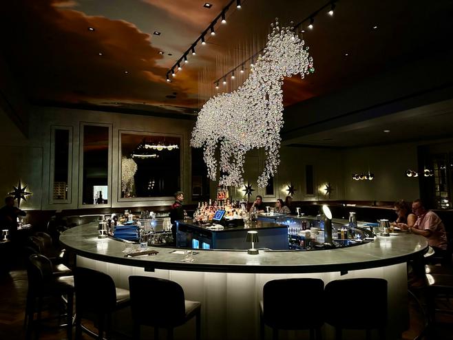 Horse chandelier hung above the bar
