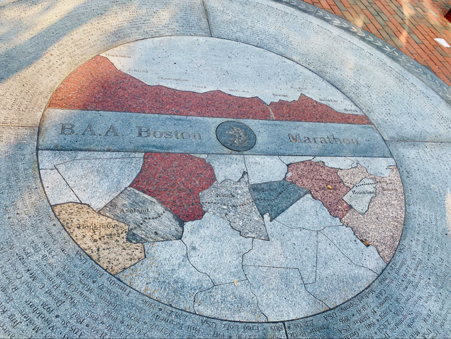 The Boston Marathon concrete insignia.
