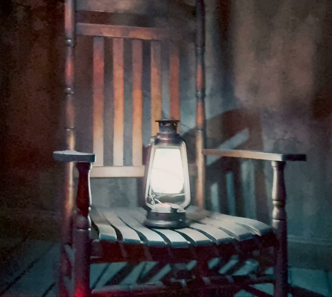 Rocking chair with lit lantern