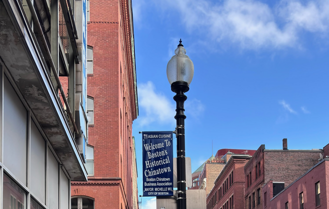 Street sign in Boston near the Hyatt Regency, promoting the city's Chinatown neighborhood.