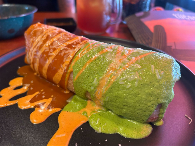 A chimichanga covered with red and green salsa at Amelia's Mexican Kitchen in Tucson.