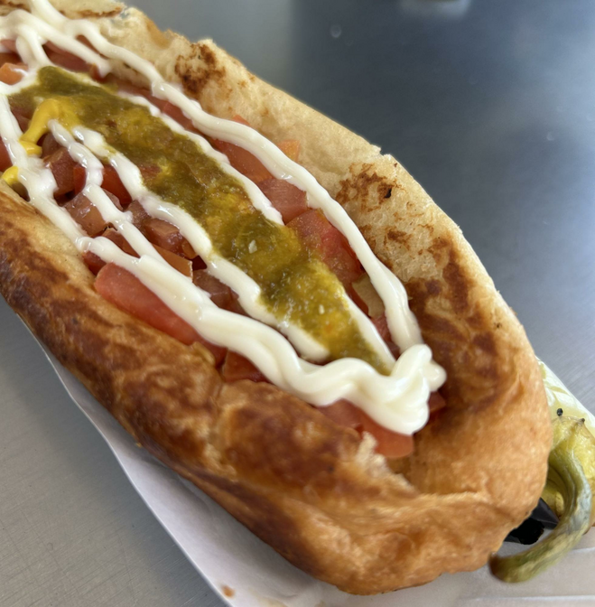 Sonoran Hot Dog (a bacon-wrapped dog topped with beans, tomatoes, onions, mayo, mustard and jalapeños)