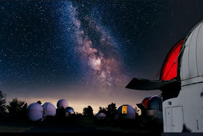 Mt. Lemmon SkyCenter Observatory at night with a view of the Milky Way.
