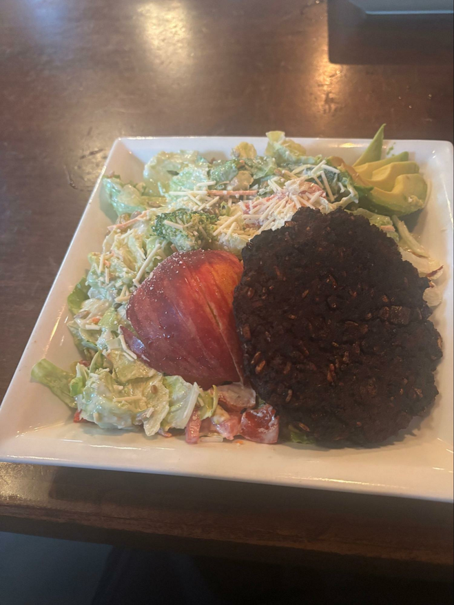 Ceasar salad with apple, avocado and vegan burger
