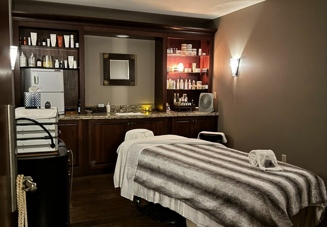 a massage table in dim lighting at a resort spa