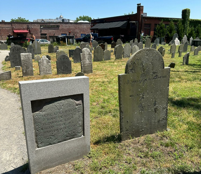 Several antiquated gravestones in the Charter Street Cemetery in Salem, Massachusetts.