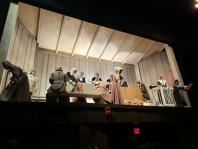 Lit vignette of what a Salem witch trial would have looked like in 1692, at the Salem Witch Museum.