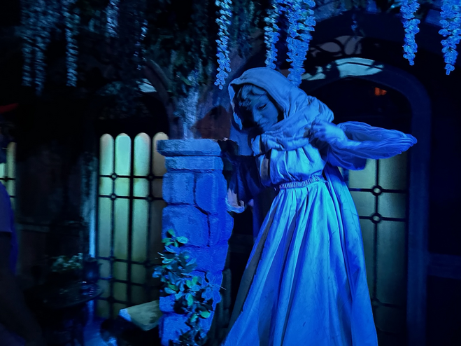 A statue coming to life in a haunted house.