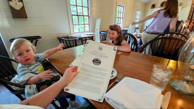 Two children sitting at the dinner table eating at Christiana Campbell's Tavern