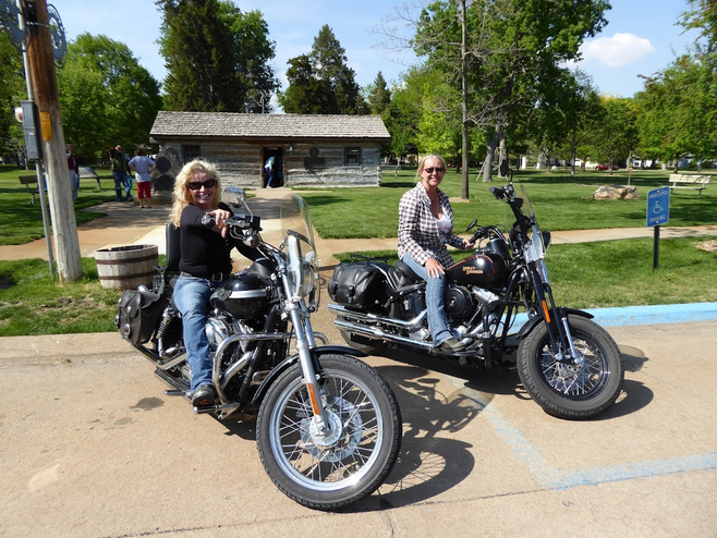 Women motorcycle riders at a pitstop.