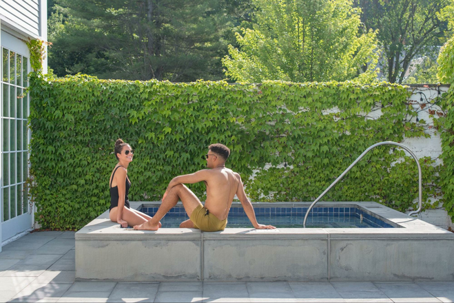Two people in a hot tub outdoors